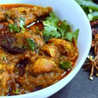 Chicken Chettinad. · Typical South Indian Chettinad style preparation with boneless chicken, onions & spices.