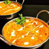 Butter Chicken. · Boneless Chicken cubes cooked in creamy butter and tomato-based gravy with spices.