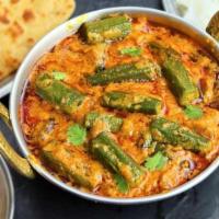 Bhindi Masala. · Fried okra cooked in onion and tomato-based gravy with Indian spices.