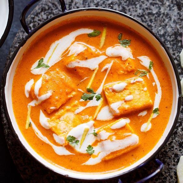 Paneer Butter Masala. · Cottage cheese cubes in a rich creamy tomato-based gravy.