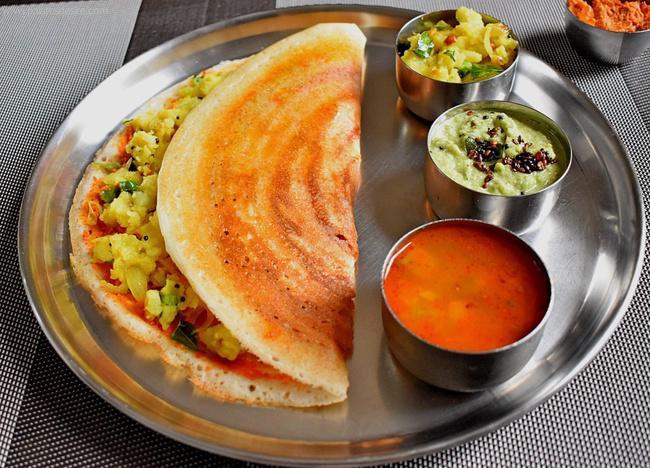 Mysore Masala Dosai. · Thin crepe made of rice & lentil with spicy Red chutney & filled with seasoned potato masala.