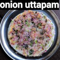 Onion Chili Uthappam. · Soft pancake made of lentils and rice topped with chili and onion