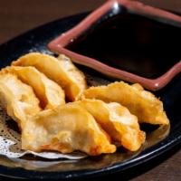 Gyoza (6 pieces) · Dumpling with minced meat and vegetable.