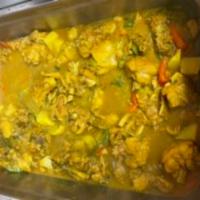 Curried Chicken · Come with rice rice and peas or white rice and one  side 