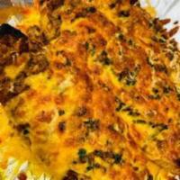 Beef Canoes   · Stuffed sweet plantain with ground beef topper with an assortment of cheeses