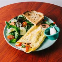 Veggies Omelette · Spinach, tomatoes, grilled red pepper and Swiss cheese with toast and side salad