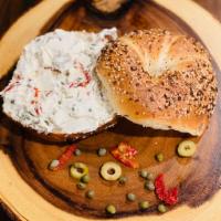 Franklin Bagel · Fresh hand rolled bagels with cream cheese which prepared with green olives,capers and sun d...