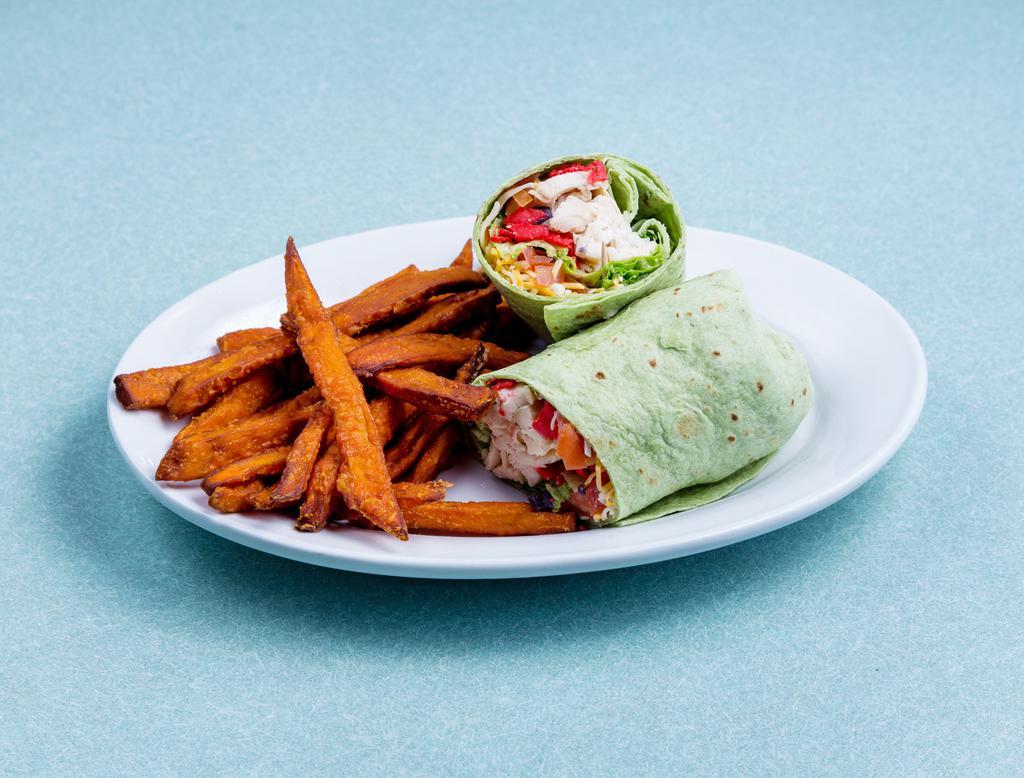 Hot Southwest Chicken Wrap · Grilled chicken breast, lettuce and tomato topped with pepper jack cheese, chipotle ranch and a mix of tortilla strips in a spinach wrap.