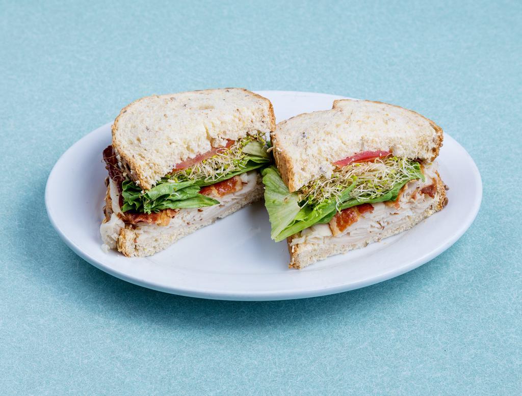 Mediterranean Club Sandwich · Oven gold turkey, bacon, avocado, lettuce, tomato and chipotle mayonnaise served on toasted multi-grain bread.