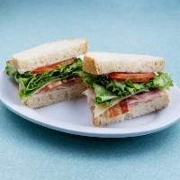 Classic Club Sandwich · Black Forest ham, oven gold turkey, bacon, lettuce, tomato and mayonnaise served on sourdoug...