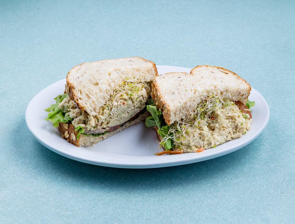 Classic Tuna Sandwich Combo · Fresh house made Albacore tuna salad, lettuce, tomato and mayonnaise served on multi-grain sandwich bread with choice of side.