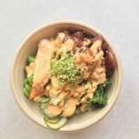 Ahi Poke Bowl* · Sushi rice, ocean salad, edamame, shrimp, pickled cucumber, sriracha aioli, sesame seeds.