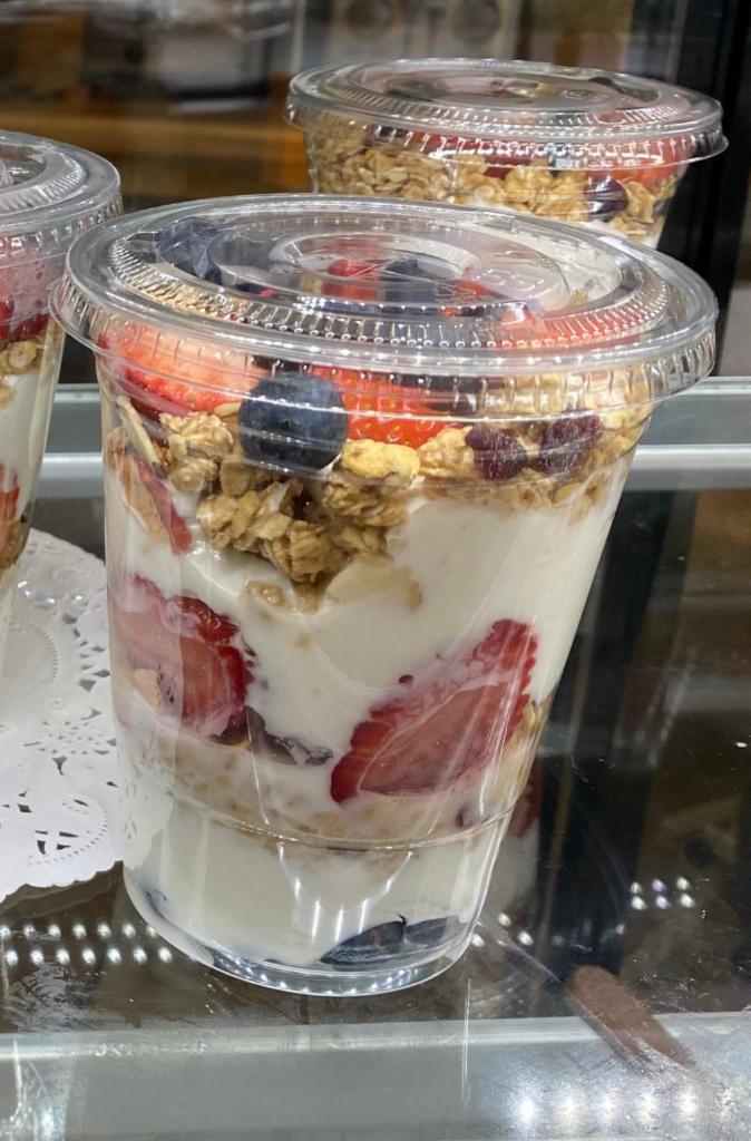 Greek Yogurt Parfait · Creamy Greek yogurt with strawberries, blueberries and granola.