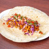 Soyrizo Burrito · With: whole beans, homemade soyrizo, cabbage, and pico de gallo. Vegan!