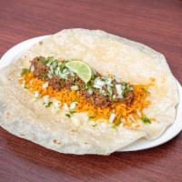 Birria burrito · With: slowly cooked shredded beef, onions, and cilantro, birria broth, lime juice, and rice. 
