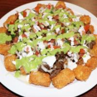 Nacho Tots  · Tator Tots topped with your choice of meat, cheese, pico de gallo, avocado sauce and sour cr...