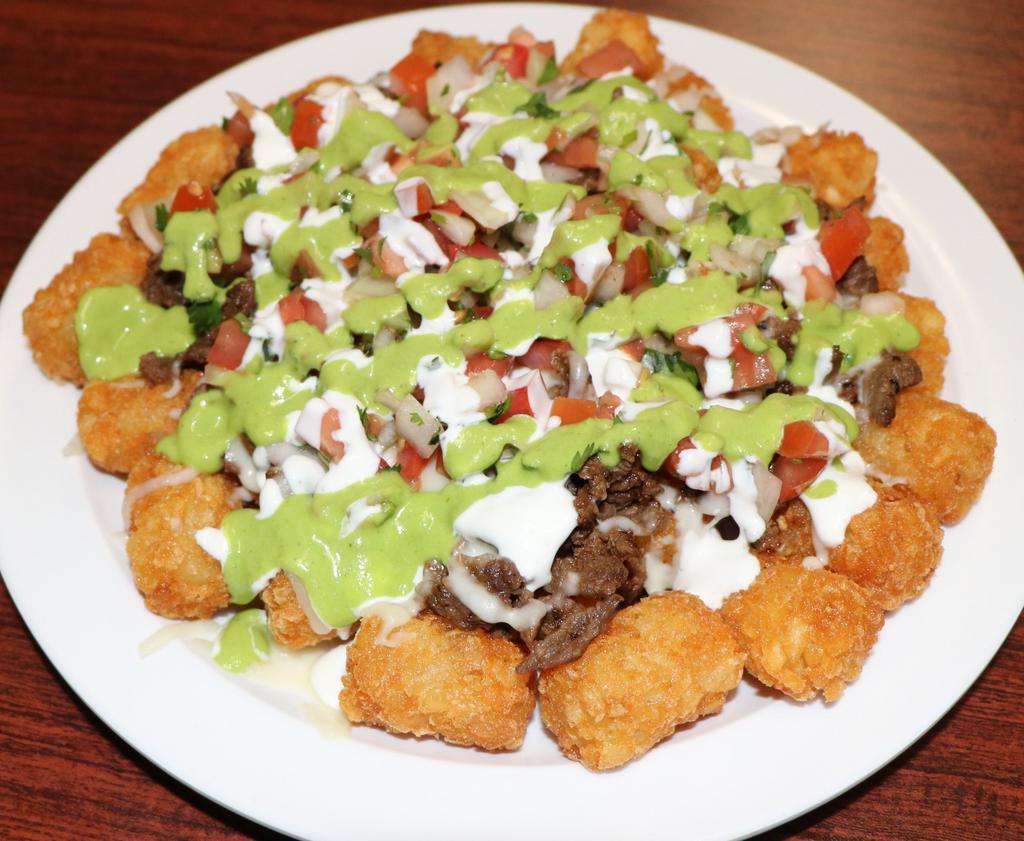 Nacho Tots  · Tator Tots topped with your choice of meat, cheese, pico de gallo, avocado sauce and sour cream. 