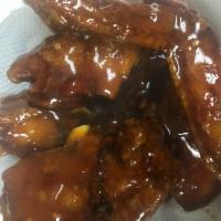 14. Wings with Garlic Sauce · Hot and spicy.