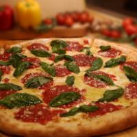Margherita Pizza · Homemade marinara sauce, fresh mozzarella and basil.