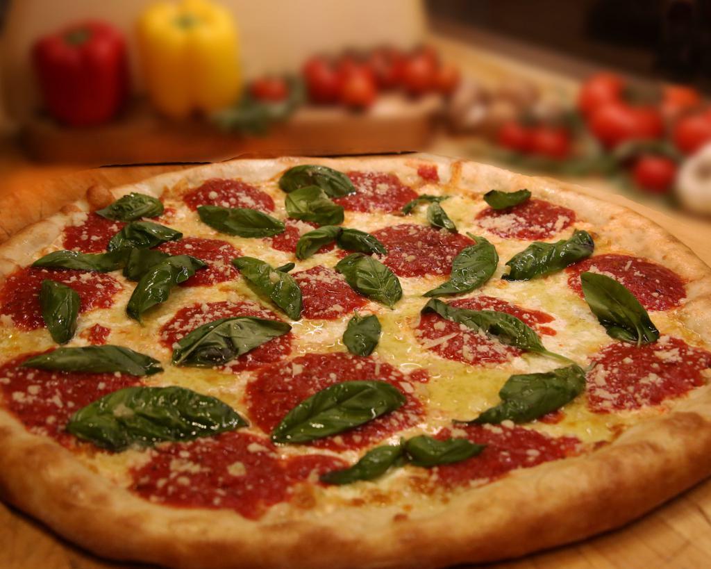Margherita Pizza · Homemade marinara sauce, fresh mozzarella and basil.
