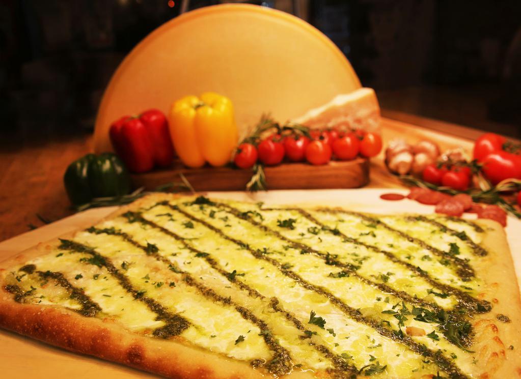 White Pesto Pizza · Mozzarella, ricotta, Parmigiano Reggiano and pesto sauce (no marinara sauce).