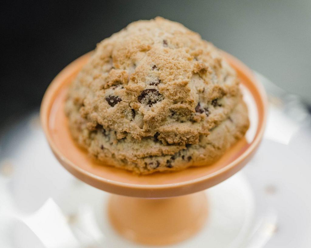 Classic Chocolate Chip · Our flagship cookie: she’s an extra thiccc chocolate chip cookie that thinks shes the top of a cupcake. This lorge gorl is moist and cake-like and invokes that “made by a grandma” feeling you get when eating an awesome chocolate chip cookie. Like a warm hug, but in cookie form. Contains: flour, sugar, brown sugar, chocolate cane sugar, unsweetened chocolate, cocoa butter, whole milk powder, soy lecithin, vanilla extract, butter milk, salt, eggs, salt, natural vanilla extract, baking soda and corn starch.