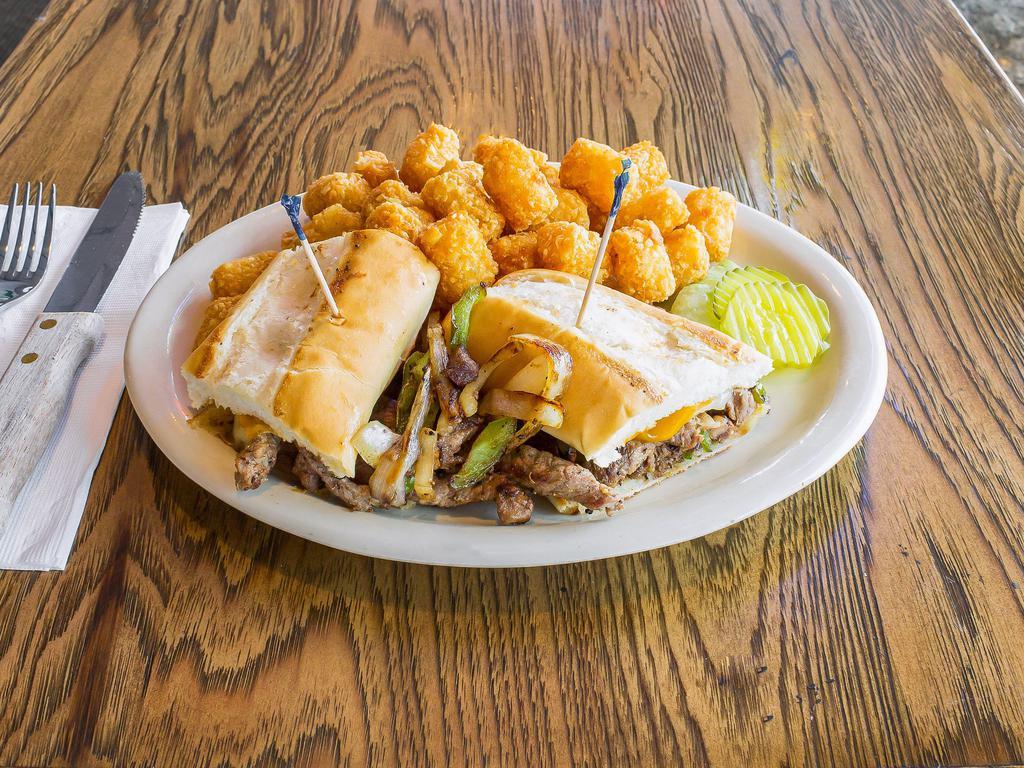 Philly Cheese Steak · Sliced angus ribeye, grilled onions and green peppers and cheese sauce. on a grilled roll. 