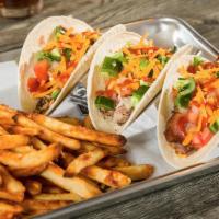 BBQ Taco Trio · One pulled pork, 1 pulled chicken and 1 smoked brisket taco each topped with cheddar cheese,...