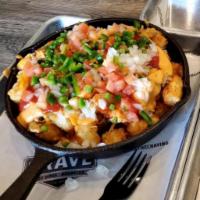 Loaded Tater Tots · Gluten free. Tater tots loaded with pulled chicken, cheddar cheese, craft beer cheese, jalap...