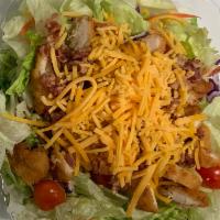 Chicken Finger Salad · Iceberg, tomato, bacon, cheddar and croutons.