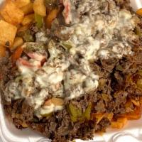 Shaved Steak Plate · Shaved steak, grilled peppers and onions, mozzarella served over macaroni salad and homefrie...