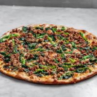 Broccoli Rabe and Sausage Pizza · Hand stretched thin crust dough topped with aged Grande Mozzarella, seasoned broccoli rabe, ...