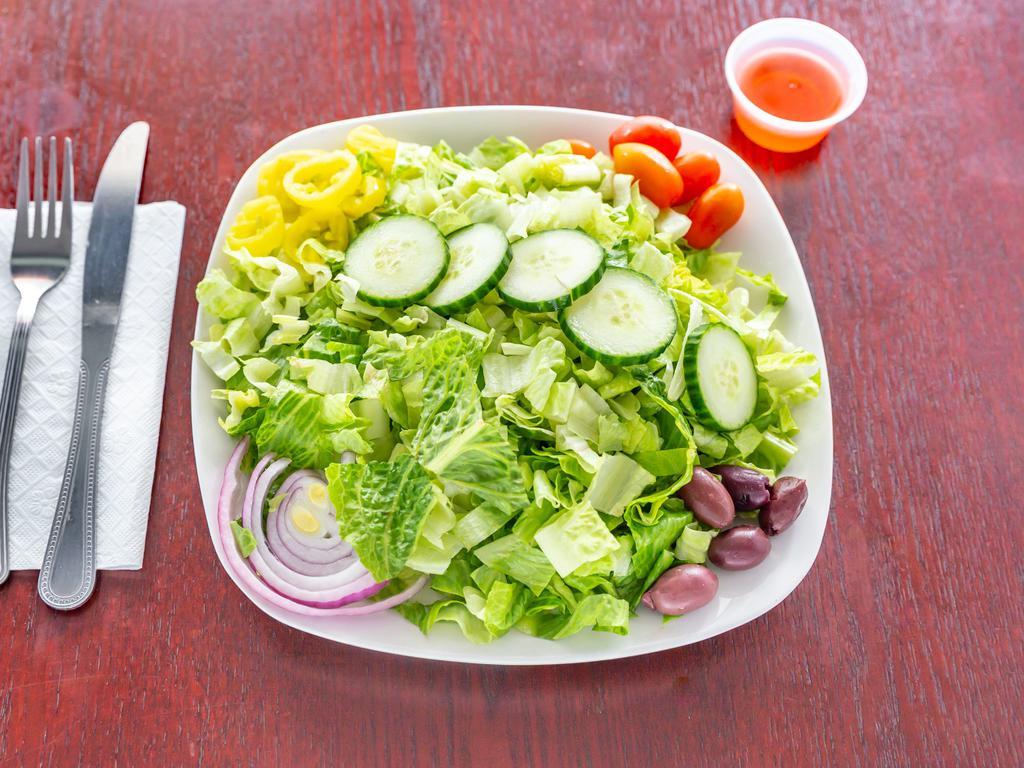 Garden Salad · Romaine lettuce, tomatoes, cucumbers, red onions, black olives and pepper rings.