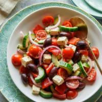 Greek Salad · Romaine lettuce, tomatoes, cucumbers, feta cheese, Kalamata olives and red onions.