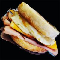 Ham, egg and cheese English muffin  · Egg, ham, Colby jack or pepper jack all in between an English muffin 