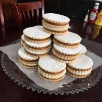 Alfajores Grandes · Delicate and Crumbly Butter Cookies Filled with Dulce de Leche.