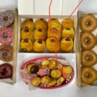Office Pack Donut · 2 dozen glazed donuts, 1 dozen chocolate donuts, 2 dozen small sausage rolls (cheese), 2 doz...