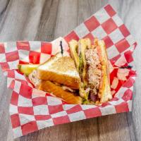 Cold Cut Turkey Club · Shaved turkey, bacon, American cheese, lettuce, tomato and mayo on 3 slices of Texas toast.
