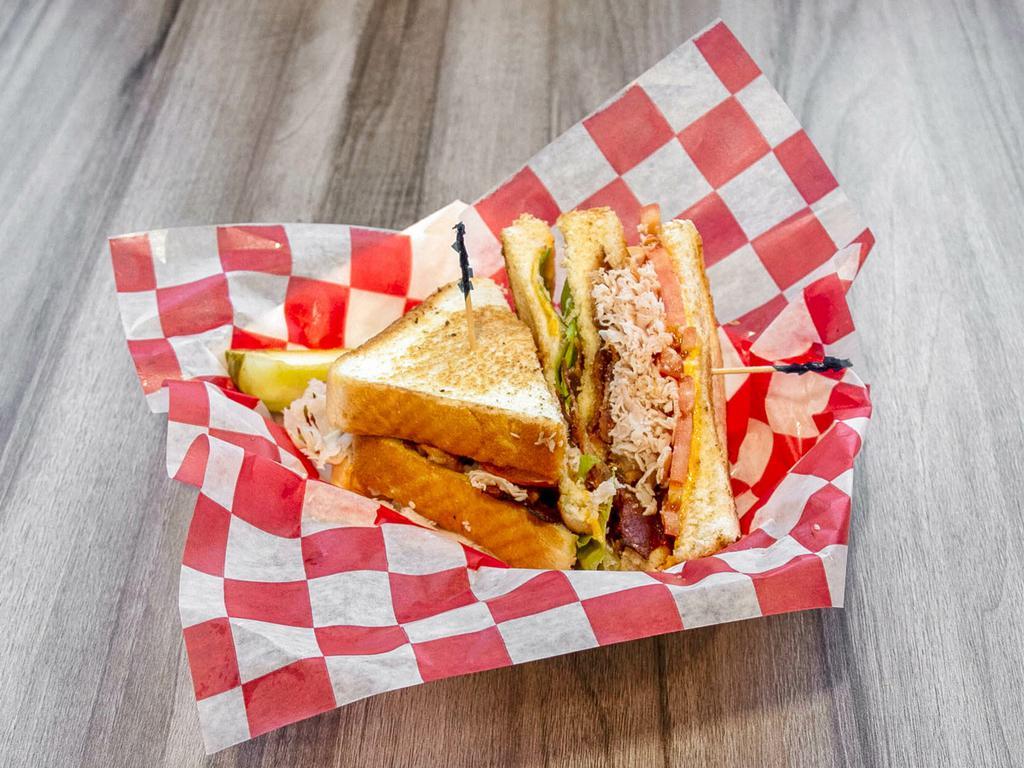 Cold Cut Turkey Club · Shaved turkey, bacon, American cheese, lettuce, tomato and mayo on 3 slices of Texas toast.