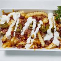 Texas Cheese Fries · Shredded Cheddar, American Cheese, Bacon, Jalapeno, Ranch dressing
