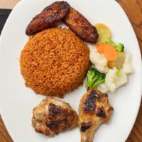 Roasted Ginger Chicken · Ginger roasted Chicken accompanied with Jollof Rice, Plantain, and Sautéed vegetables