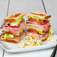 Club Sandwich · Turkey, ham, bacon, lettuce, tomato, onion and cheese.