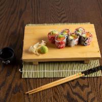 New York Roll · Spicy tuna, salmon, yellowtail, avocado and crunch with tobiko.