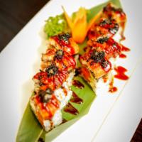 Flying Dragon Roll · Spicy tuna, avocado, crunch inside, topped with eel and black tobiko.