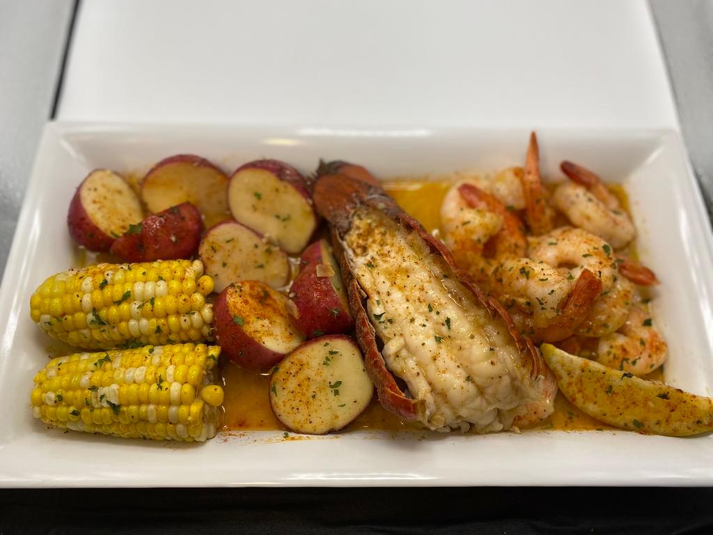 Lobster Tail and Shrimp · 6 oz Maine Lobster Tail, 10 Black Tiger Shrimp, 2 Ears of Corn, 3 Red Skin Potatoes, 4 oz of sauce and bib set.