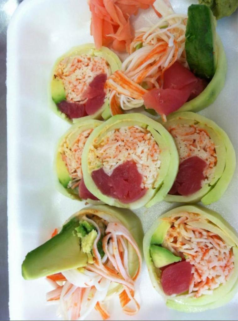 Sushi Com Roll · Tuna, salmon, crab salad, avocado, and wrapped in cucumber.