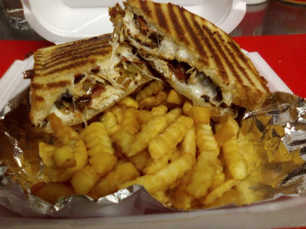 Chicken Philly Melt · Grilled chicken, peppers, caramelized onions, mushrooms, bacon and mozzarella cheese, grilled golden brown,  served with house made chips or french fries 