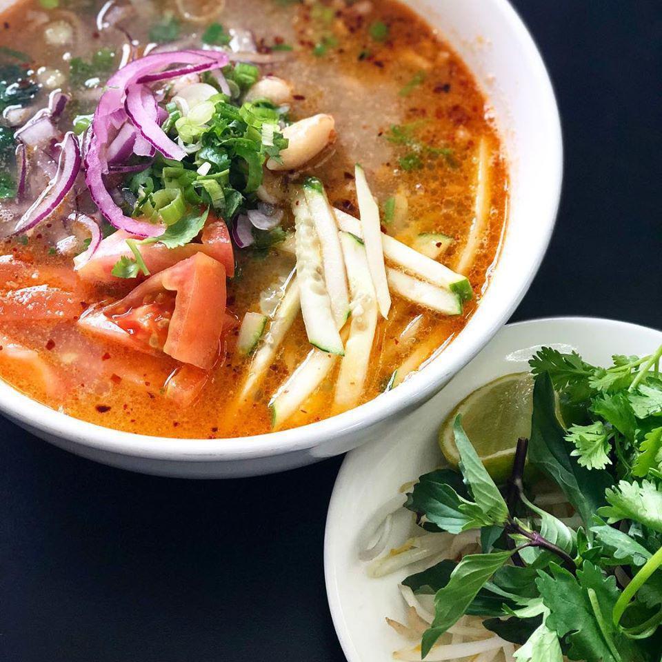 Mi Sate · Ground Pork, lean steak, tomatoes, and chopped cucumbers in rich and savory peanut butter beef broth, topped with peanuts, red onions, green onions, and cilantro with your choice of egg noodles or rice noodles. Served with a side of bean sprouts, jalapenos, lime, and cilantro. Spicy.