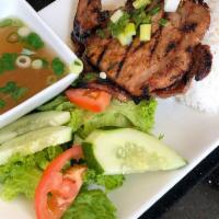 Grilled Pork Chops · Pork chops marinated in an oyster sauce recipe, with shallots, and garlic. Served with rice,...