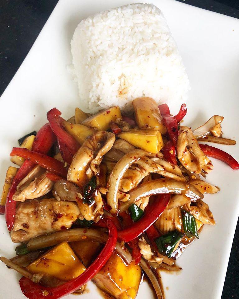 Mango Chicken · Chicken stir-fried with fresh mangos, red bell pepper, white and green onions in our savory stir fry sauce. Served with rice.